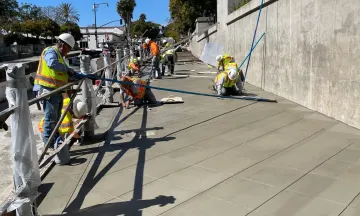 Image of construction workers paving at the State Street Undercrossing